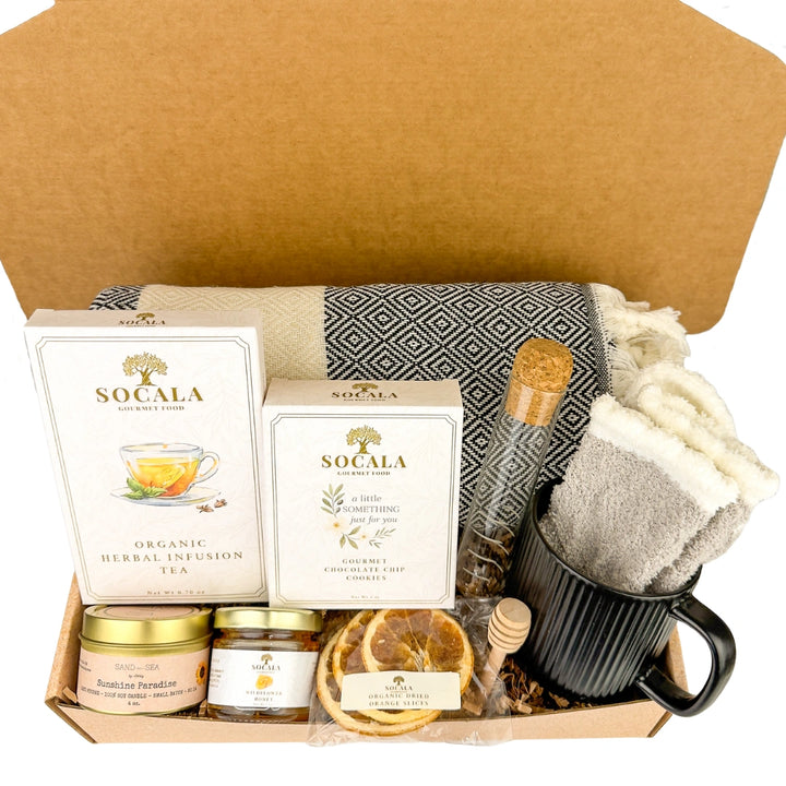 Gift set with tea, honey, and other items in a box