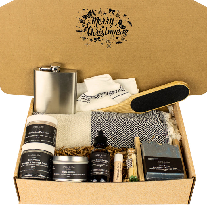Gift set for men featuring various items, including a flask, towel, and soap, in a decorative box with 'Merry Christmas' text.