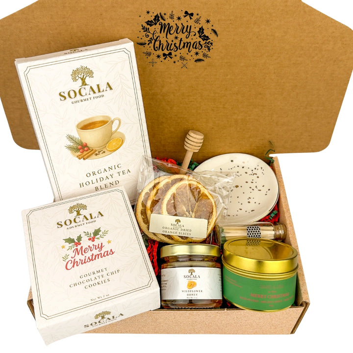 Gift box with Socala tea, cookies, and other items on a white background