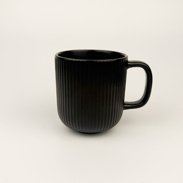 modern-ribbed-handmade-stoneware-mug-black-sand-and-sea-by-ashley