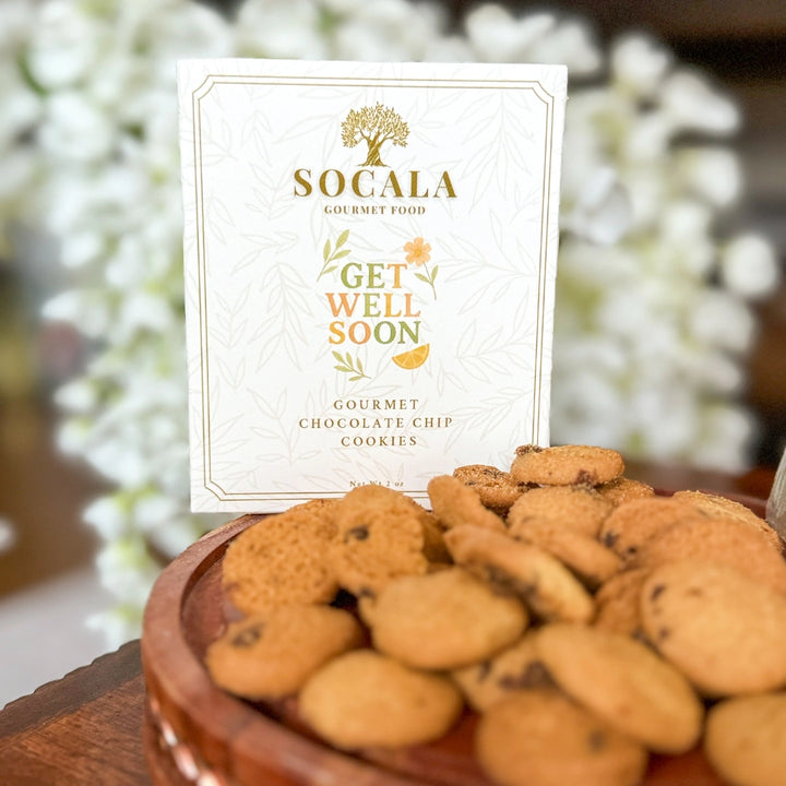 Bowl of cookies with a 'Socala Gourmet Food' card that reads 'Get Well Soon'.