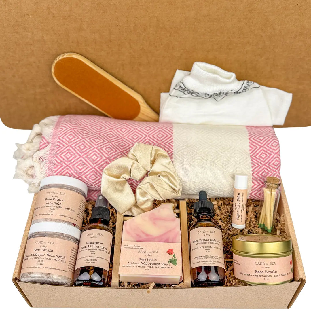 Relaxation gift basket which is rose petals spa gift basket on a white background