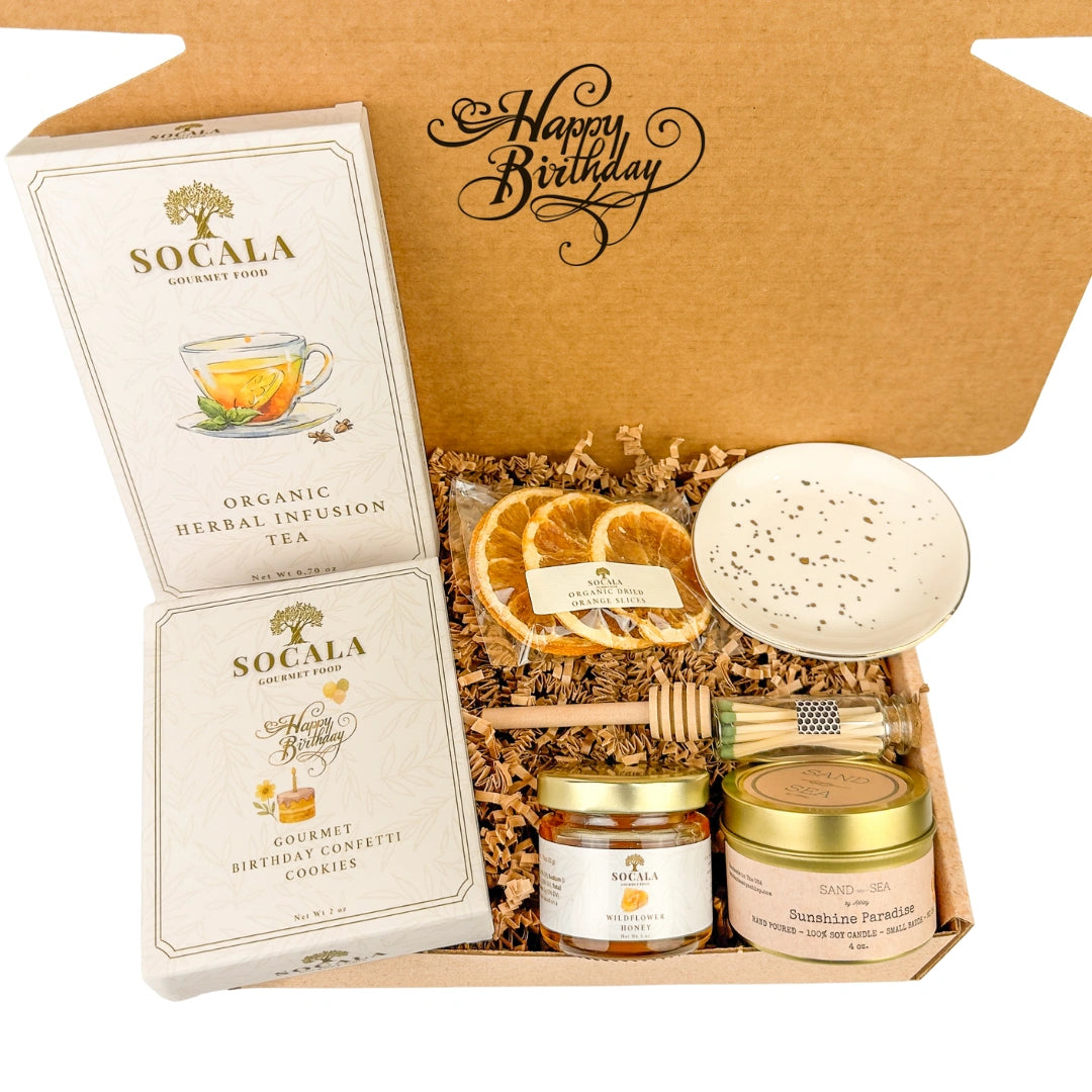 Gift set with Socala tea, cookies, and other items in a decorative box.