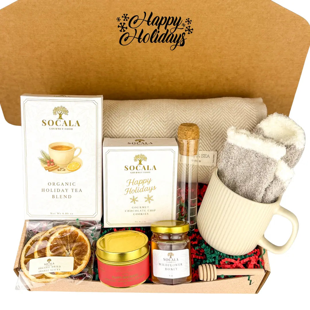 Gift box with holiday-themed items including a mug, tea, and candles, with 'Happy Holidays' text on the lid.