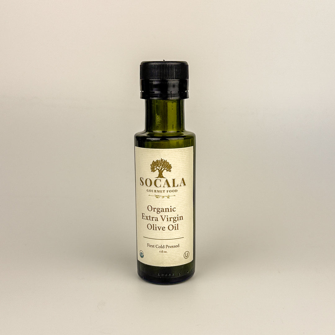 Bottle of Socala Organic Extra Virgin Olive Oil on a beige background
