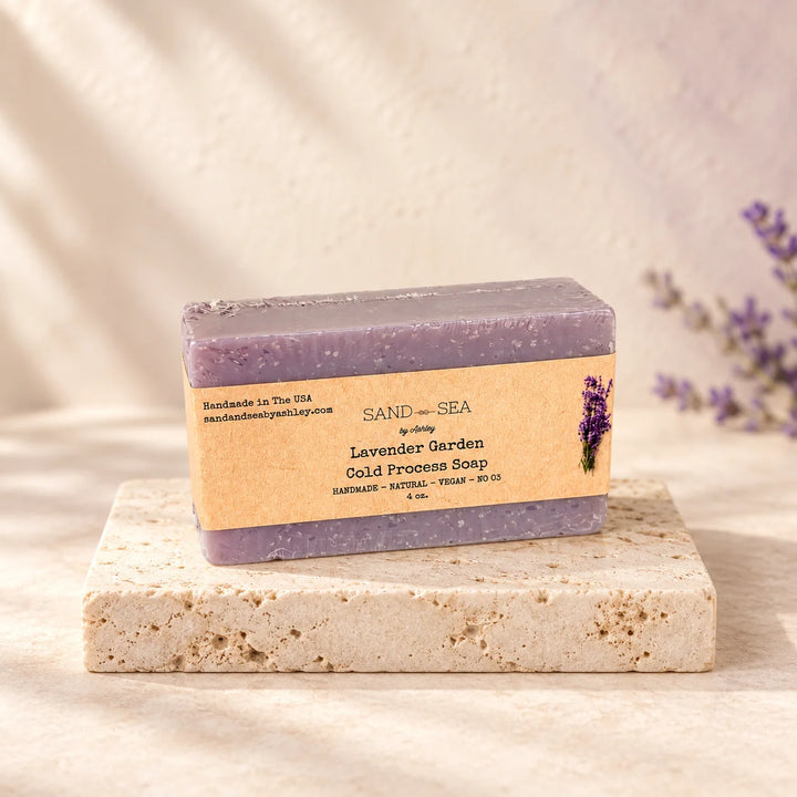 A rectangular bar of lavender soap with a kraft paper label reading &