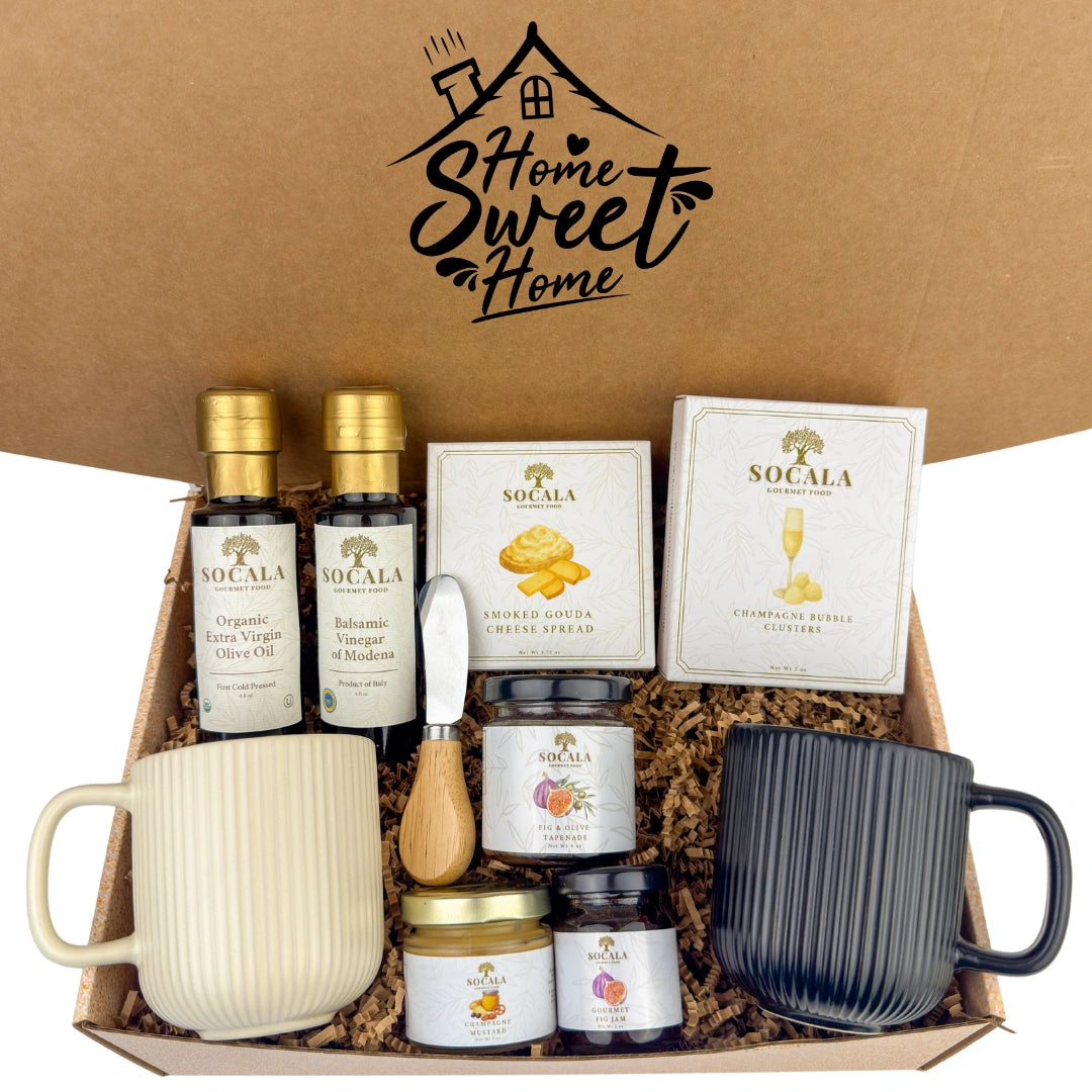 Gift box with various products including mugs, jars, and bottles with 'Socala' branding on a brown background.