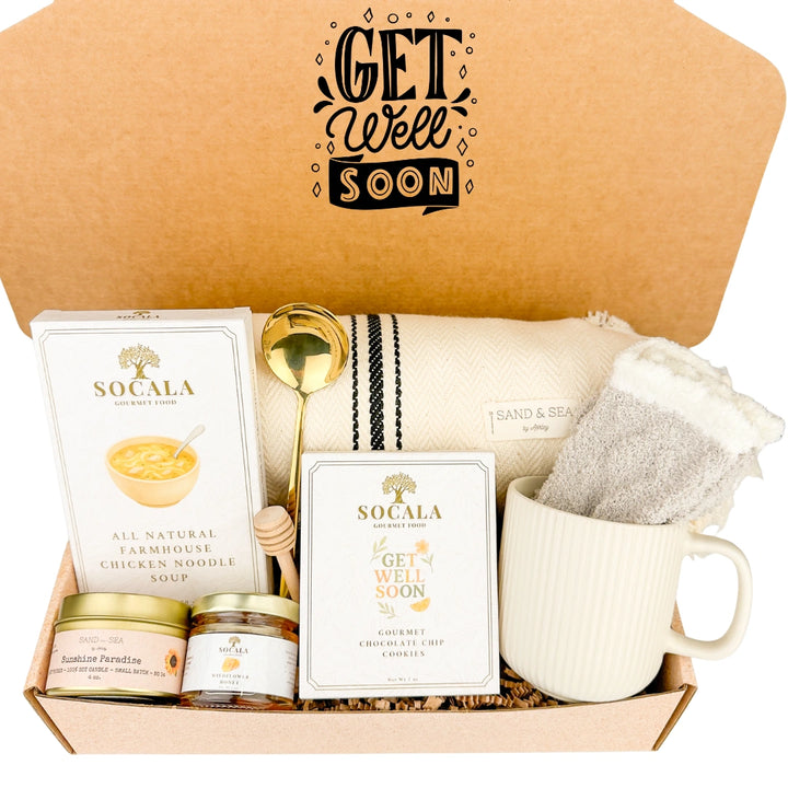 Get well soon care package with Socala soup, mug, farmhouse blanket, and other items in a box.