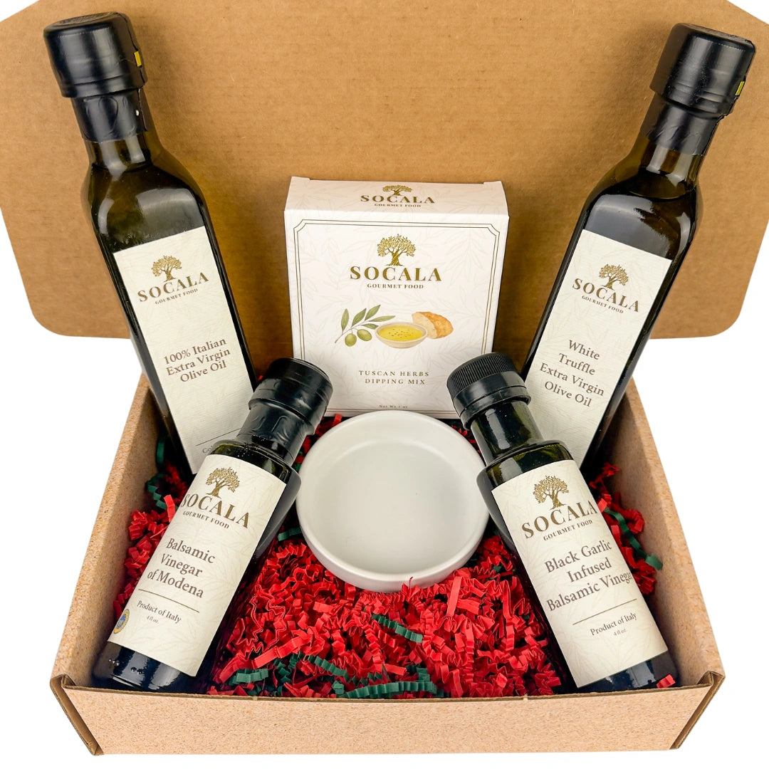 Socala olive oil and vinegar set in a gift box with red and green paper.