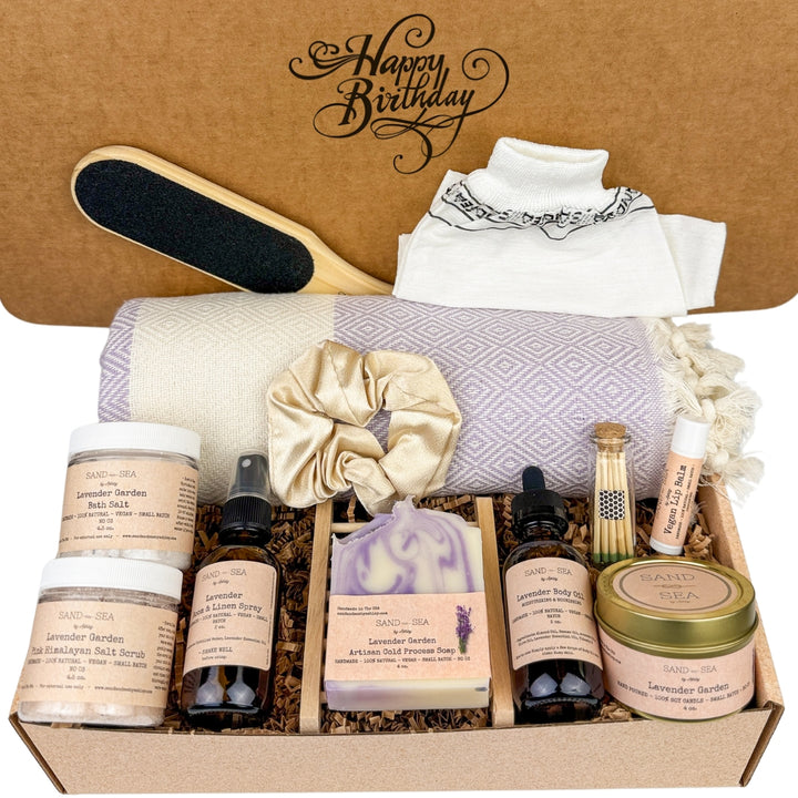 Gift box with self-care products and a 'Happy Birthday' card on a brown background