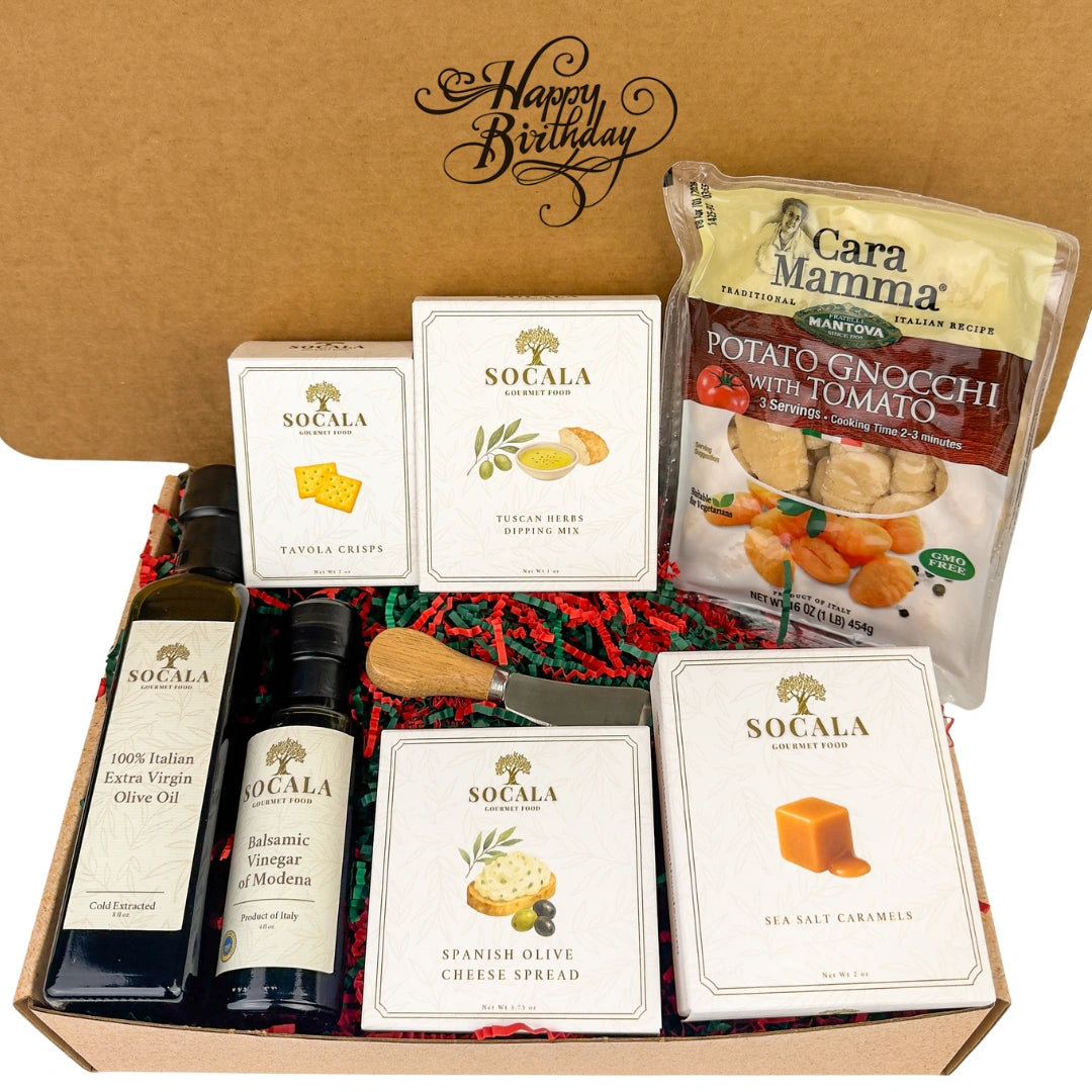 Gift box with Italian food products including olive oil, cheese, and pasta.