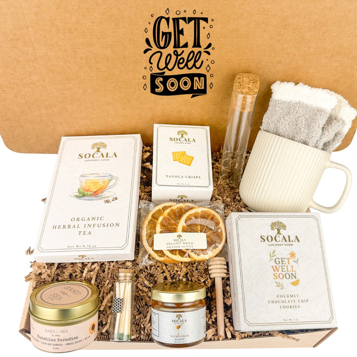 Gourmet gift set with 'Get Well Soon' card and various items on a brown background