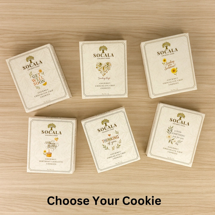 Six SOCALA cookie boxes on a wooden surface with 'Choose Your Cookie' text.