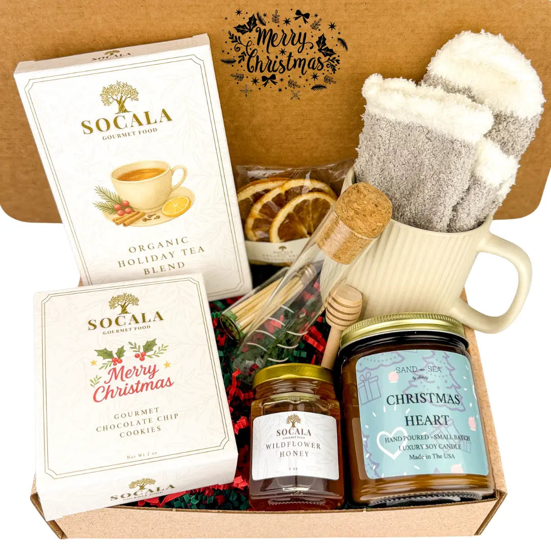 Gift set with Socala tea, honey, and candles in a box with 'Merry Christmas' text.
