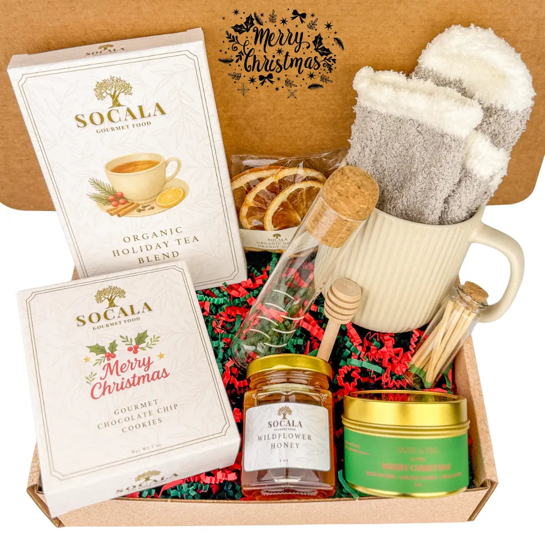 Gift set with tea, cookies, honey, and candles with 'Socala' branding and Christmas-themed packaging.