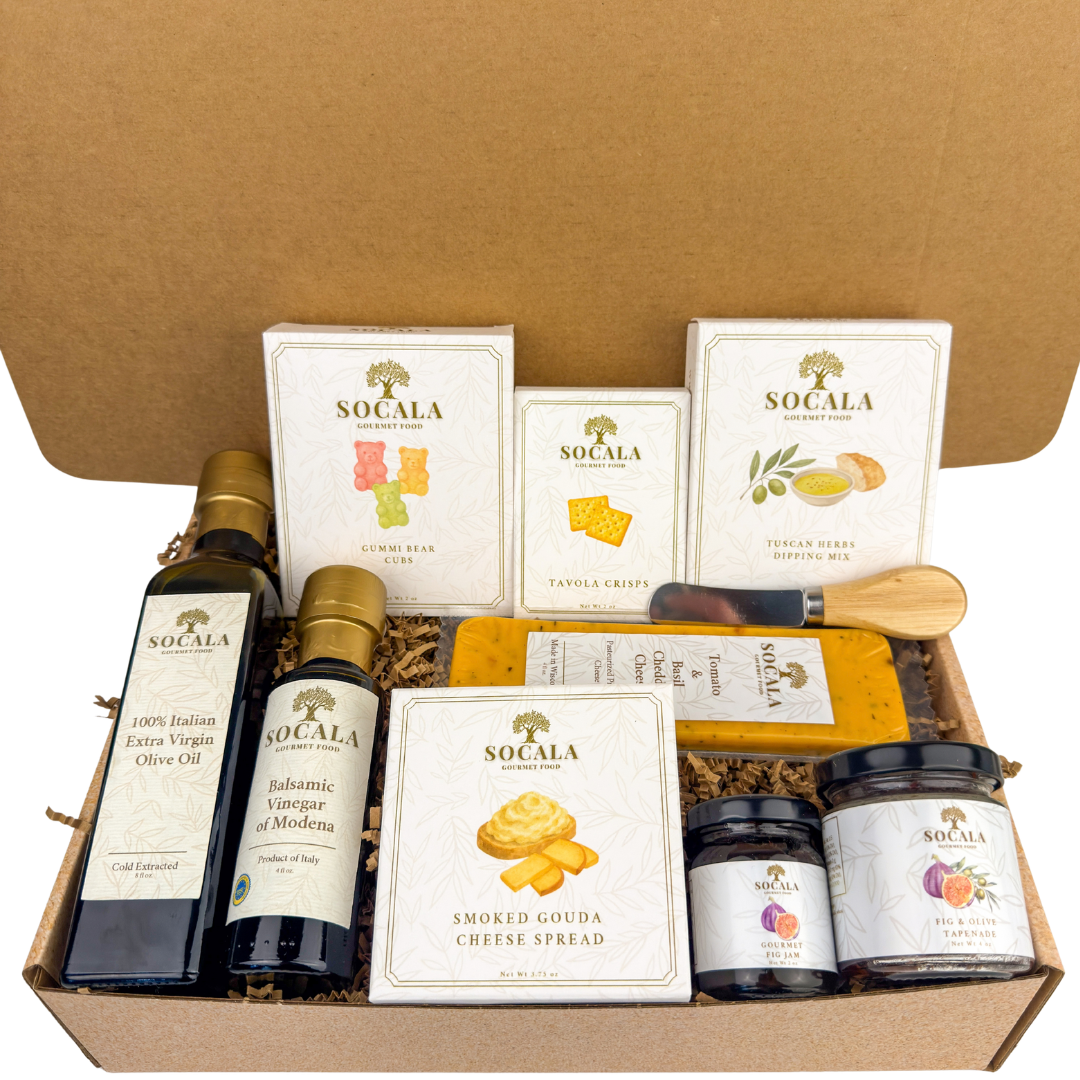 Gourmet food gift set with olive oil, cheese, and crackers in a cardboard box.