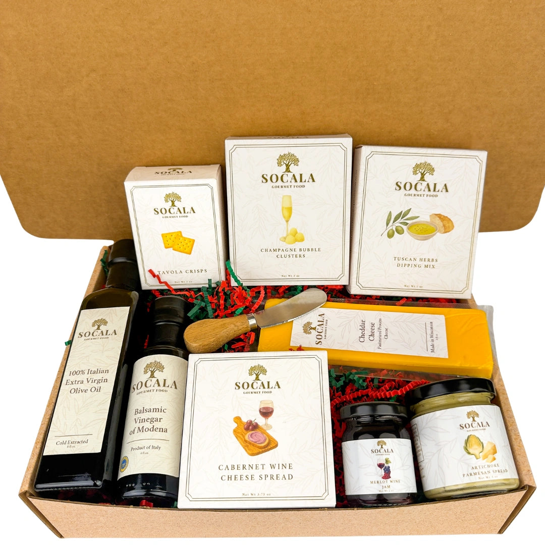 Gourmet gift set with Socala products including olive oil, cheese, and spreads in a cardboard box.