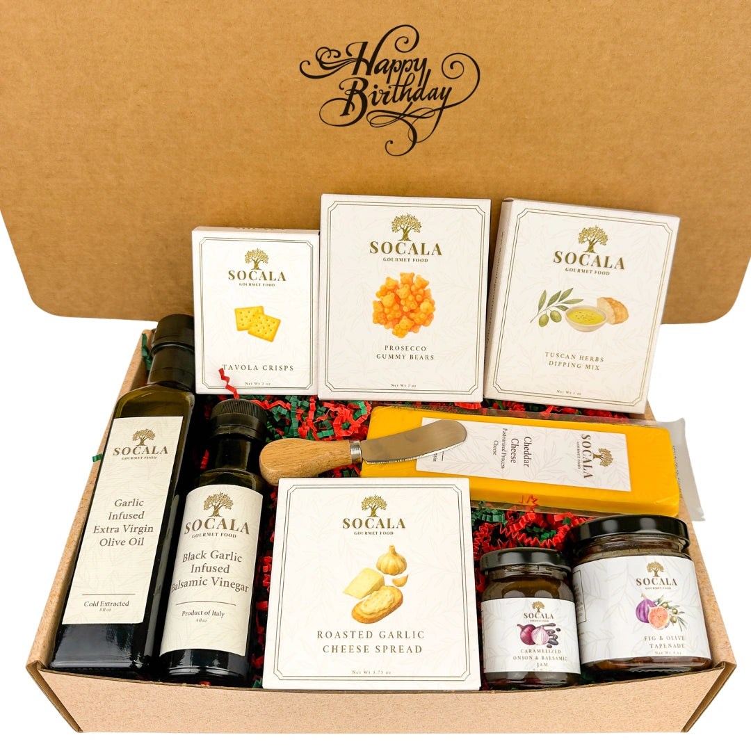 Gift box with Socala brand products including olive oil, cheese, and spreads on a white background.