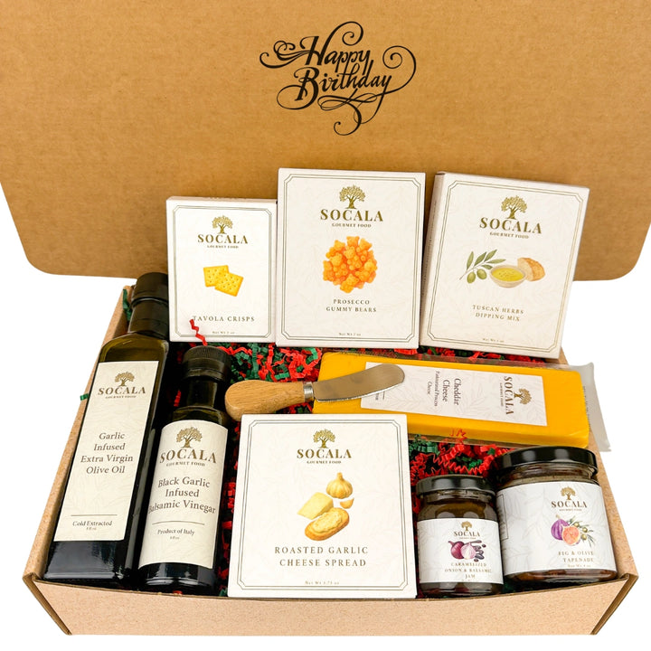 Gift box with Socala brand products including olive oil, cheese, and spreads on a white background.
