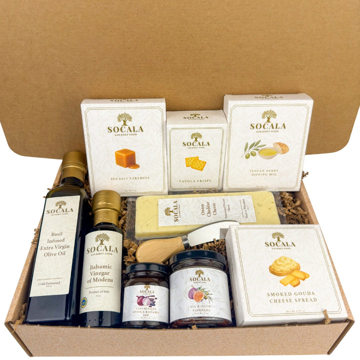 Gourmet gift set with Socala products including olive oil, vinegar, and cheese in a cardboard box.