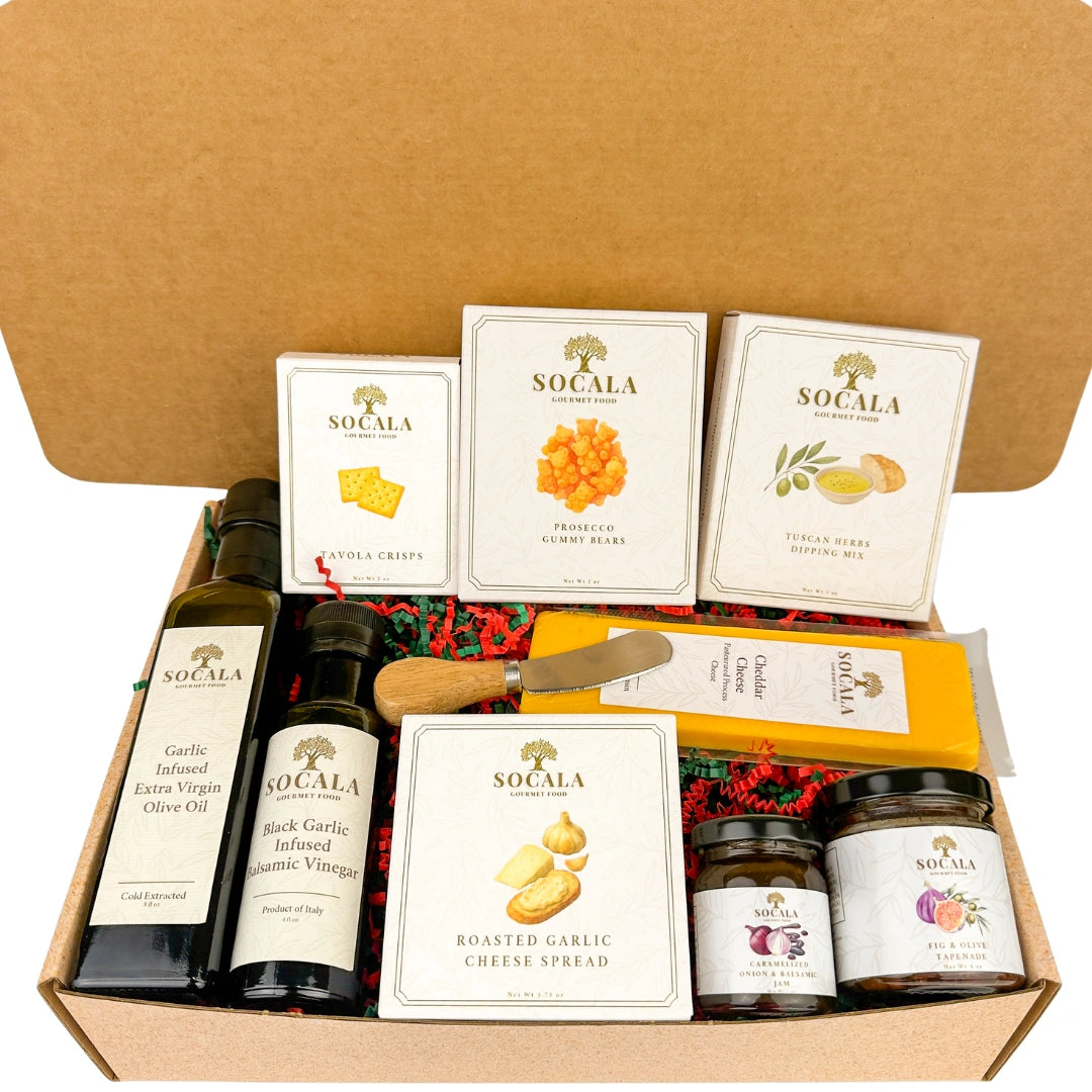 Gourmet gift set with olive oil, cheese, and other items in a box
