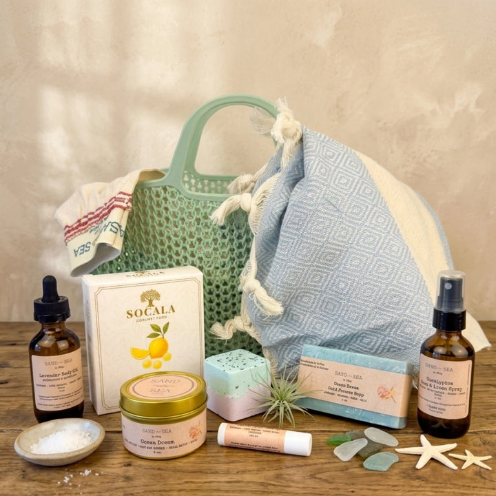 Collection of natural skincare and wellness products on a wooden surface with a neutral background.