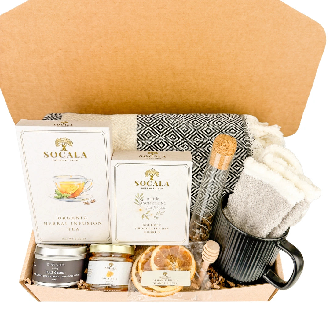Gift basket with tea, mug, and snacks in a box