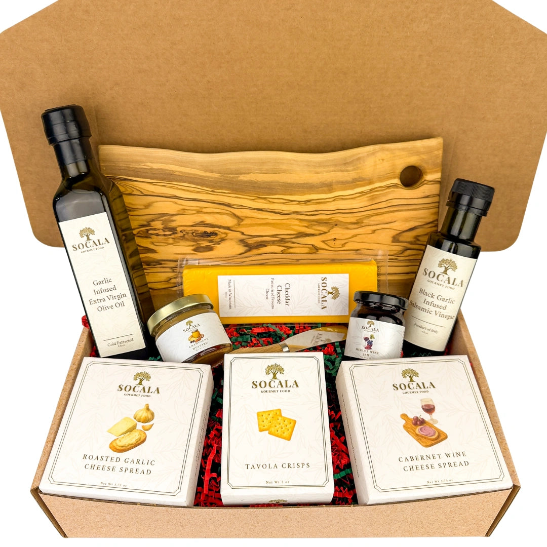 Gourmet food gift set with olive oil, cheese, and crackers in a box.