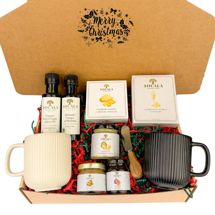 Gift set with mugs, olive oil, and other items in a decorative box with 'Merry Christmas' text.