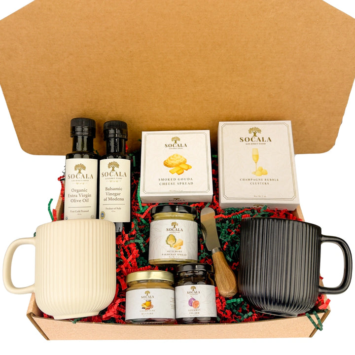 Gift set with mugs, olive oil, and other items in a box
