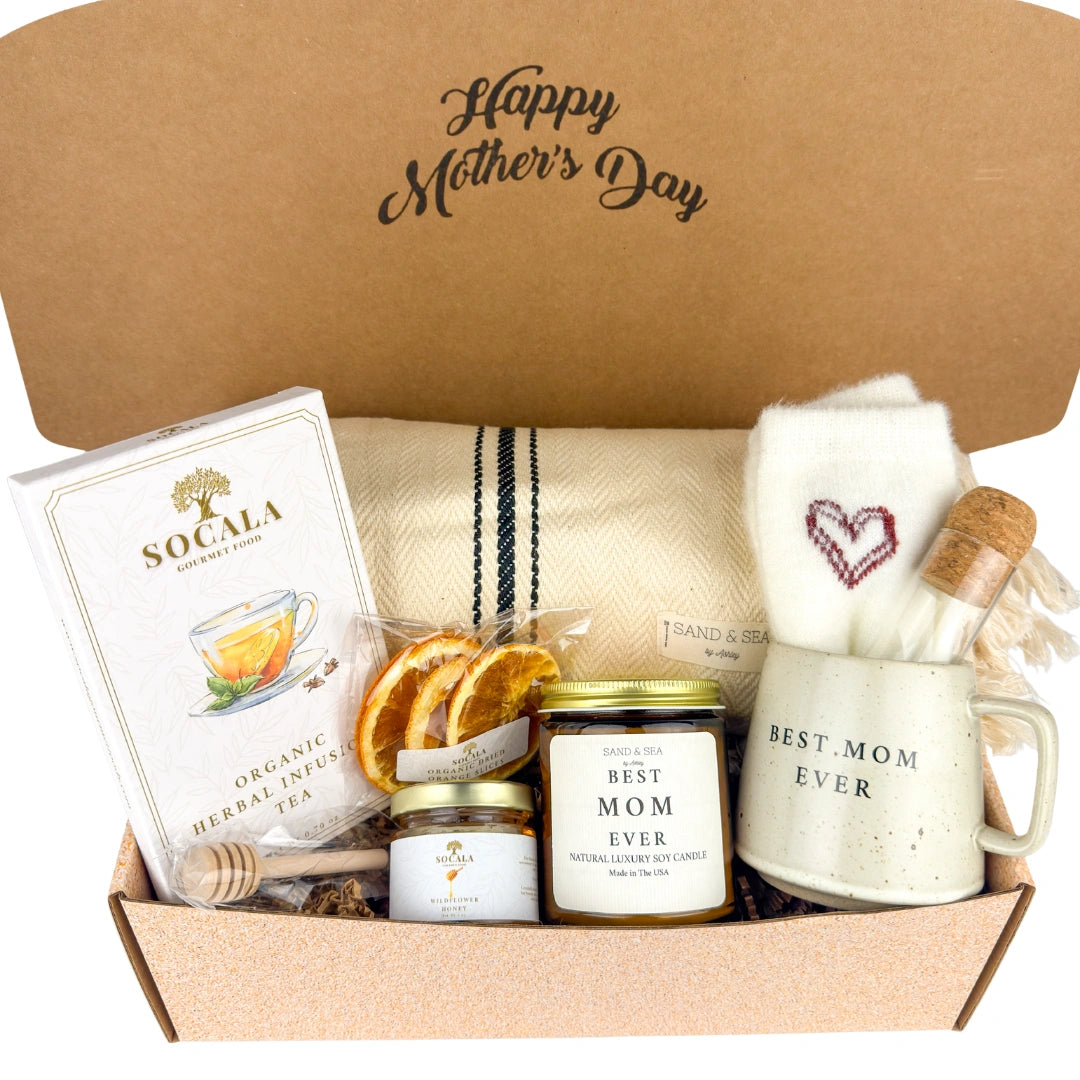 Gift box with Mother's Day items including a mug, tea, and candle.
