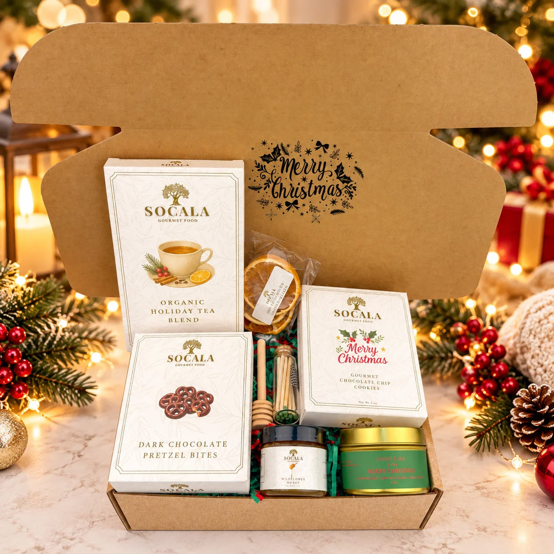 Gift box with Socala tea, cookies, and other items on a white background