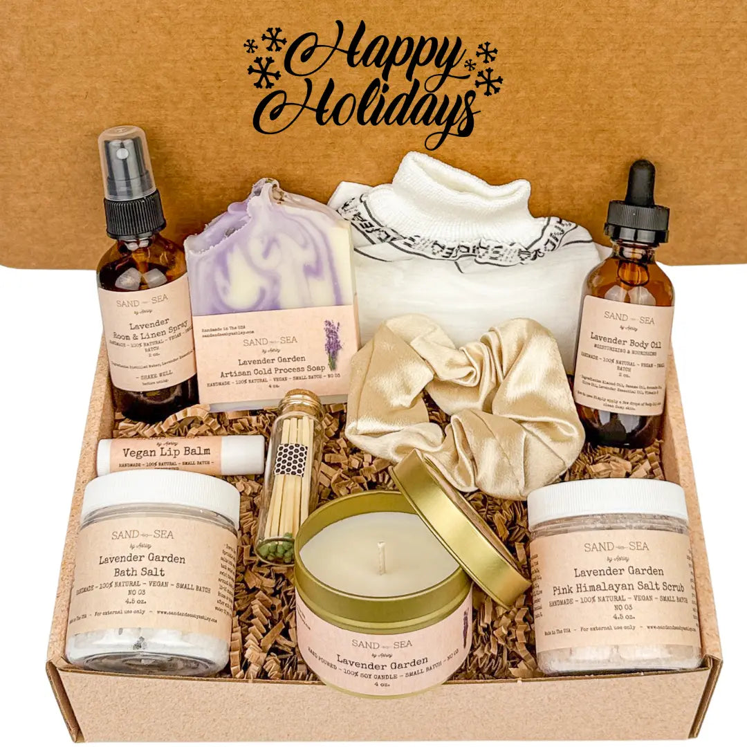 Gifting set with lavender-themed products including candles, oils, and bath salts in a 'Happy Holidays' box.