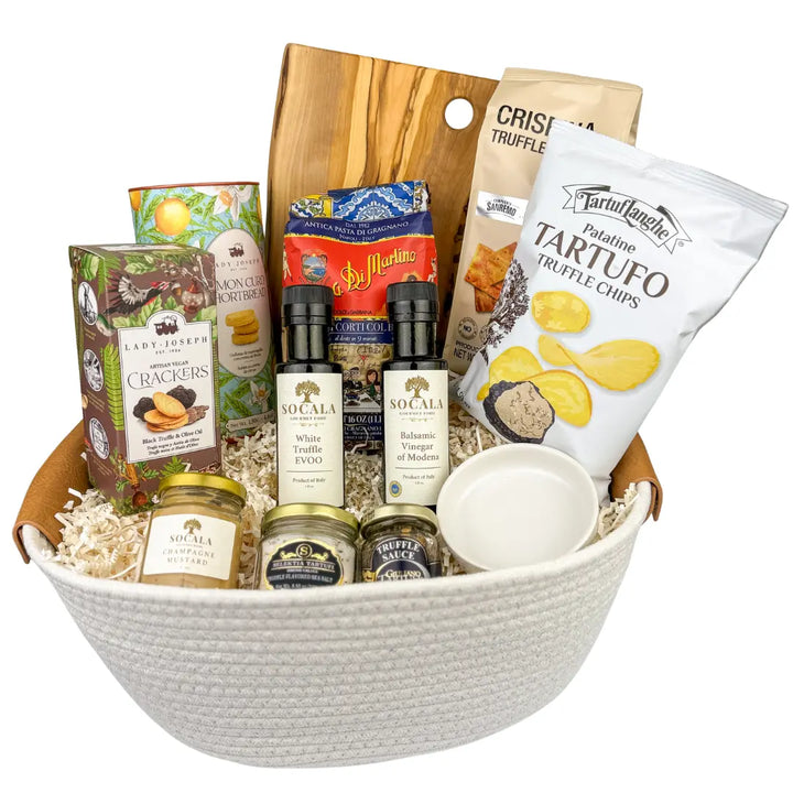 Gourmet gift basket with truffle-themed products including crackers, chips, and sauces.