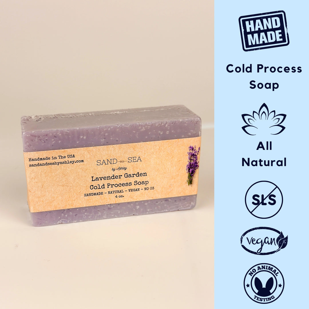 Handmade lavender garden cold process soap bar with branding and certification icons on a beige background