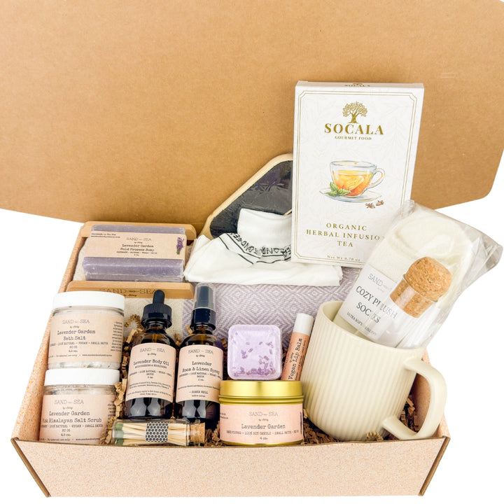 Gift basket with skincare products, tea, and a mug on a beige background