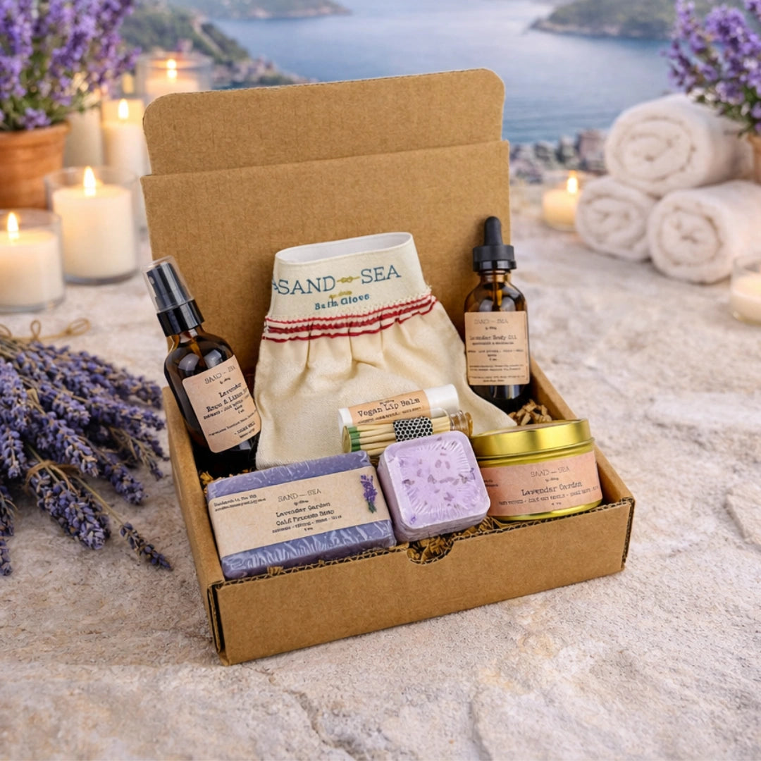 Box of lavender-themed products with candles and lavender flowers on a scenic background