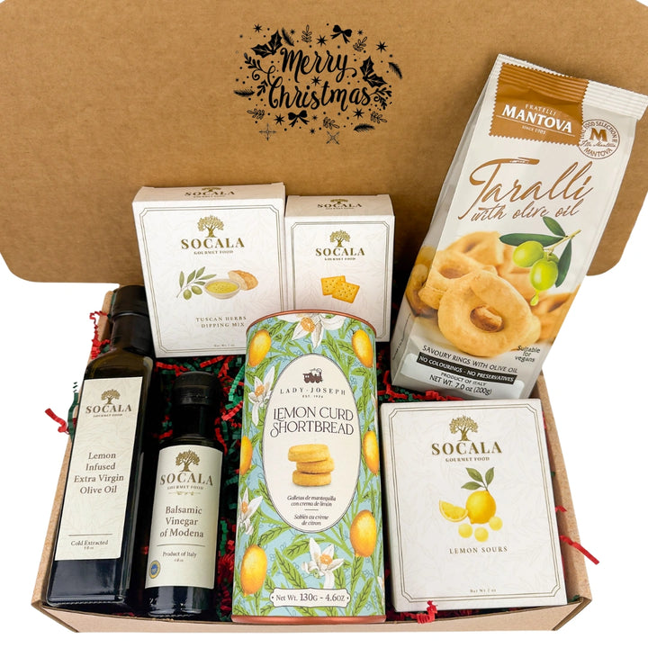 Gourmet gift box with olive oil, shortbread, and cookies on a white background