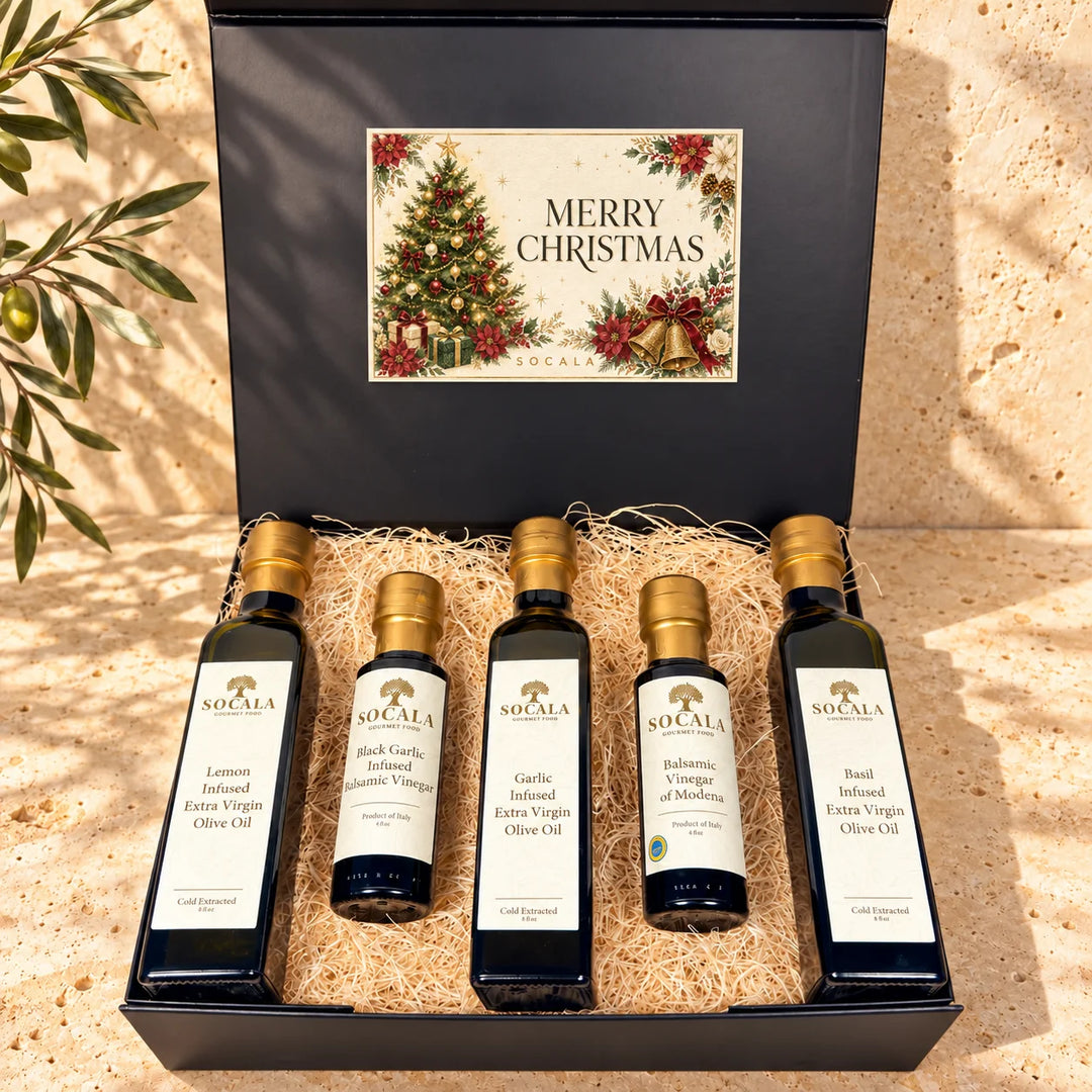 Set of Socala olive oil and vinegar bottles in a decorative box with 'Merry Christmas' text.