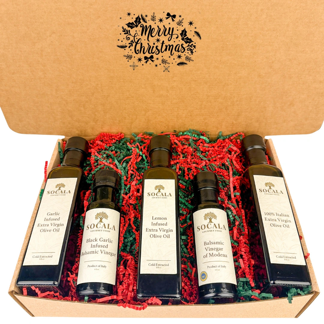 Set of Socala olive oil and vinegar bottles in a decorative box with 'Merry Christmas' text.