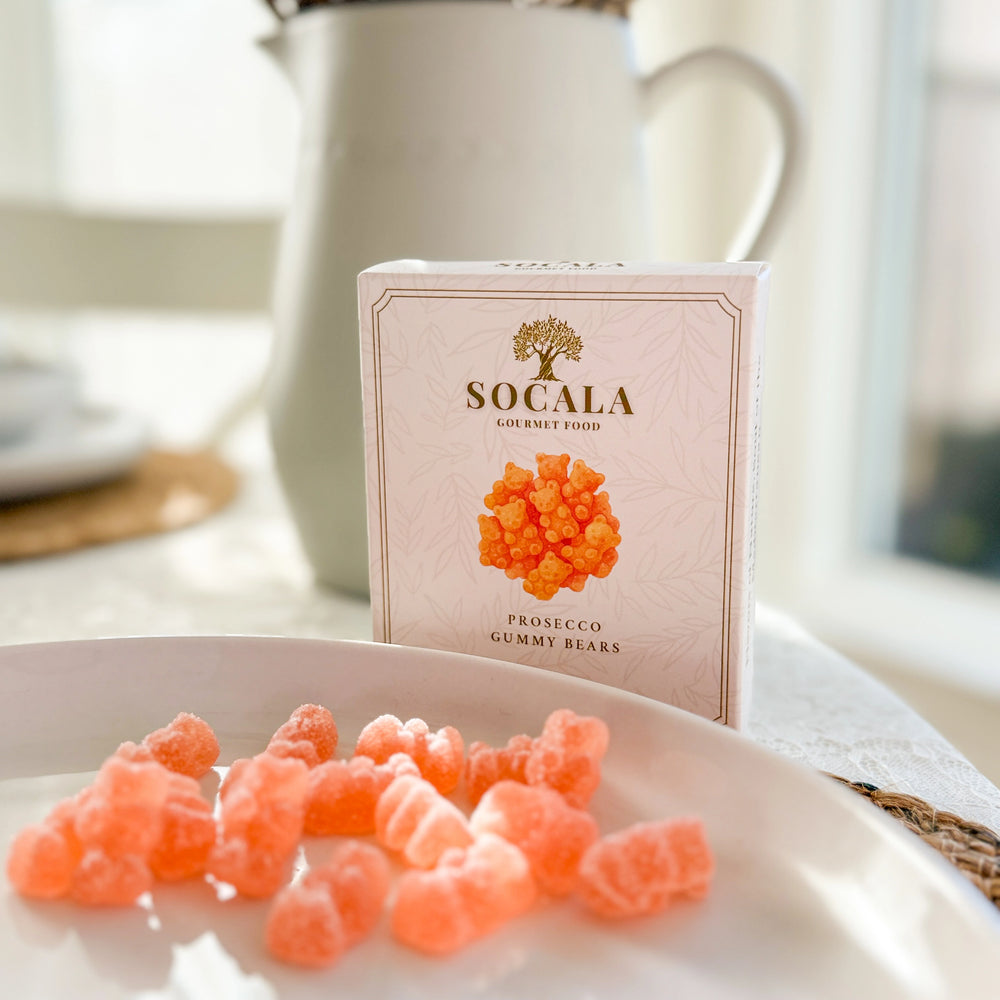 Box of SOCALA Prosecco Gummy Bears on a table with gummy bears in front