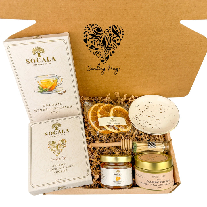 Gift set with Socala tea, cookies, and honey on a white background