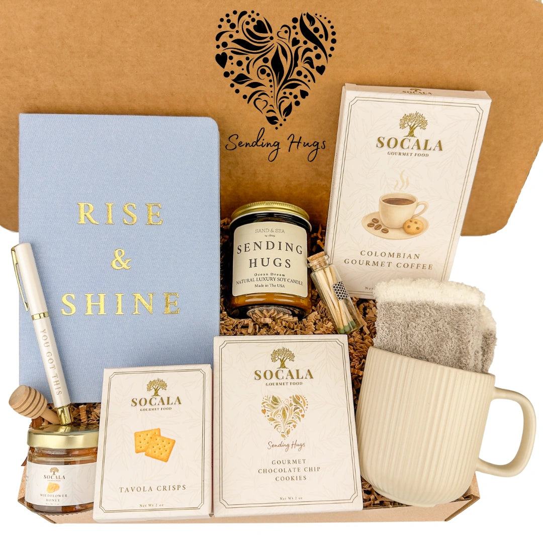 Gift set with 'Rise & Shine' notebook, candles, and snacks in a box labeled 'Sending Hugs'.