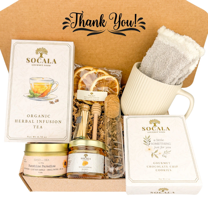 Gift box with Socala tea, cookies, and other items with 'Thank You!' text above.