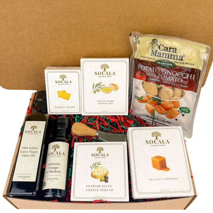 Gourmet food box with Socala olive oil, vinegar, and cheese spread, Cara Mamma potato gnocchi, and other items.